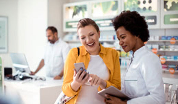 Women looking at phone together