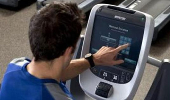 Man touching Precor screen