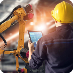 Engineer in hard hat uses tablet to control a yellow robotic arm in a factory.