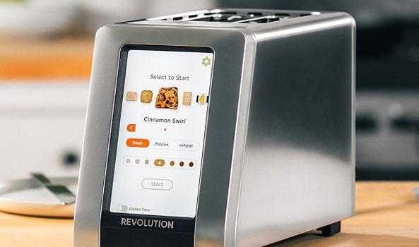 Modern silver toaster with a large touchscreen display showing toast settings.