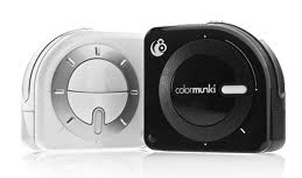 White and black ColorMunki color measurement devices.